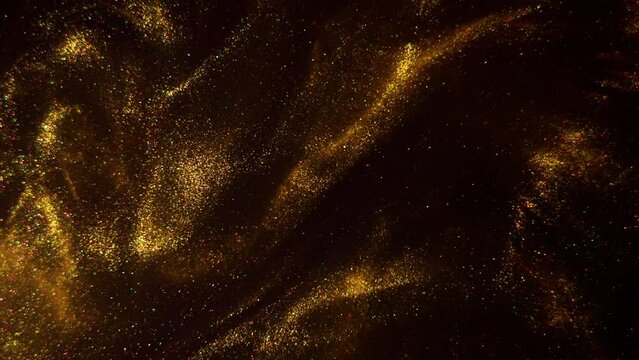 Beautiful swirling textures in gold and black. Captivating gold paint in motion.
