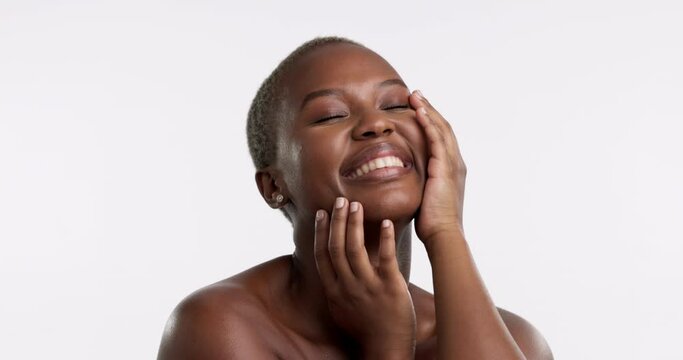 Happy, black woman and hands on face in studio for skincare, self love or cosmetics on white background. Portrait, beauty and girl model with dermatology, satisfaction or skin routine while isolated