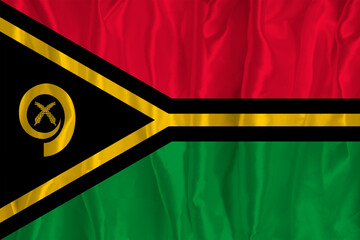 The flag of Vanuatu on a silk background is a great national symbol. Texture of fabrics The official state symbol of the country