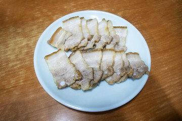 Delicious boiled pork slices on a plate.
