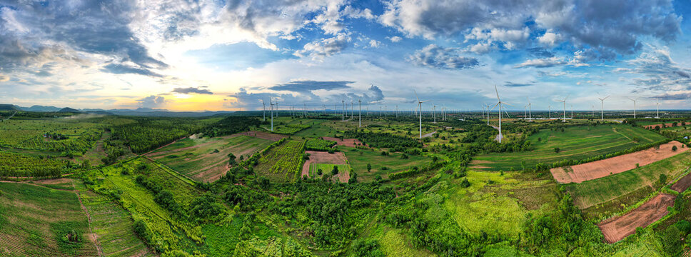 Wide shot of rural area with blue sky powered by green energy that is friendly to nature.