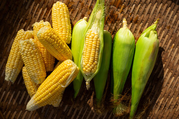 Top view of fresh corn on wooden table. Organic farming, Vegetable healthy.