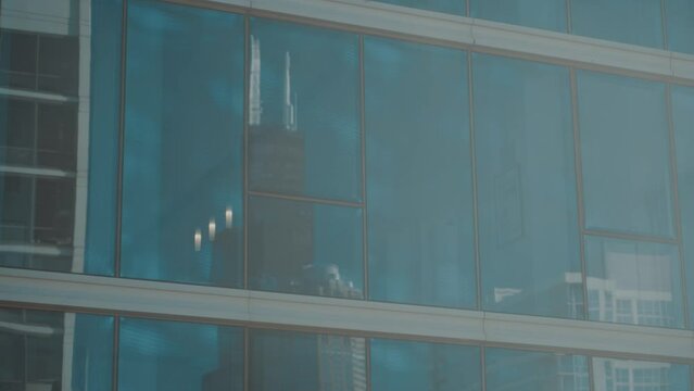 Willis tower reflected in High rise