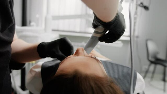 Dentistry the dentist makes a 3D scan of the patient's teeth doctor's examination toothache patient with caries