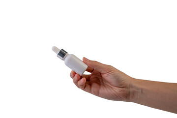 A white glass dropper bottle in hand on transparent background 