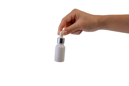 A white glass dropper bottle in hand on transparent background