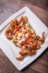 chinese and western mixed seafood combination cold platter with deep fried soft shell crab scallop salad on wood table asian banquet halal menu