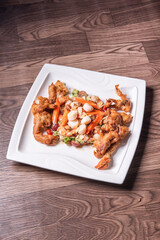 chinese and western mixed seafood combination cold platter with deep fried soft shell crab scallop salad on wood table asian banquet halal menu