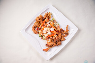 chinese and western mixed seafood combination cold platter with deep fried soft shell crab scallop salad on wood table asian banquet halal menu