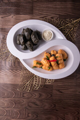 dou style deep fried crispy seafood beancurd black and white tofu in salted egg yolk sauce and mayonnaise sauce on wood table asian halal banquet appetiser snack salad menu 