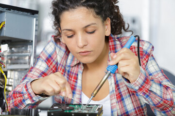 cute female engineer at home working on technology