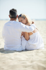 portrait of happy mature couple at the beach