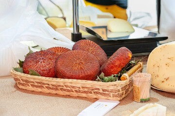 Smoked suluguni. Smoked cheese of Russian farmers at the fair of farm products