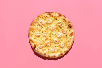 Shrimps pizza above view, isolated on a pink background