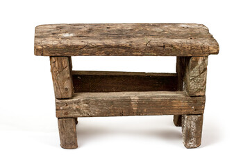 An old rustic bench. A chair made of rough boards on a white background.