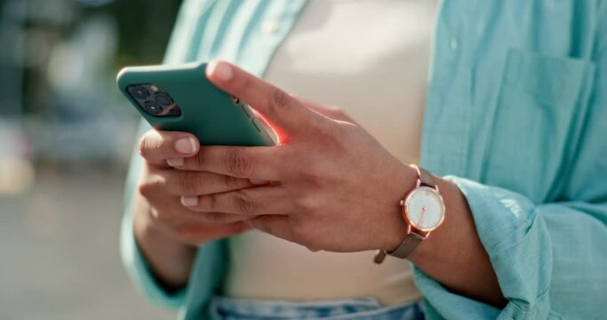 Woman, hands and phone typing in city for social media post, communication or texting in the outdoors. Hand of female chatting on mobile smartphone app for networking with 5G connection in urban town