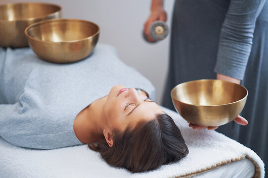 Woman having a Tibetan sound bowl massage