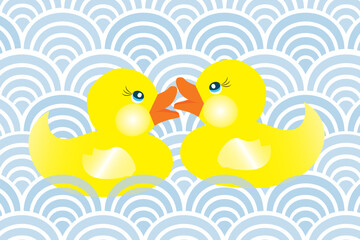 Two cute little rubber ducks in love swimming in blue waves