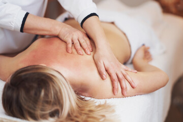 Fototapeta na wymiar Woman having back body massage in studio