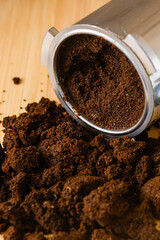 Spent or used coffee grounds with portafilter.