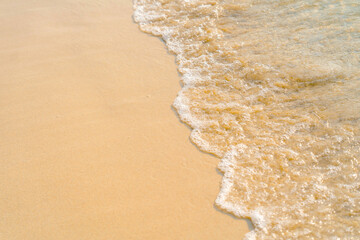 Soft waves of the sea on the sandy beach