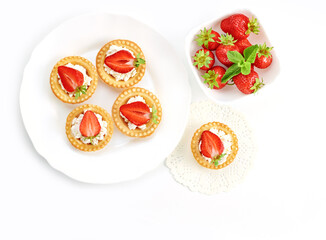 Tartlets with cottage cheese and strawberry on a white background. Cooking concept. Healthy dessert