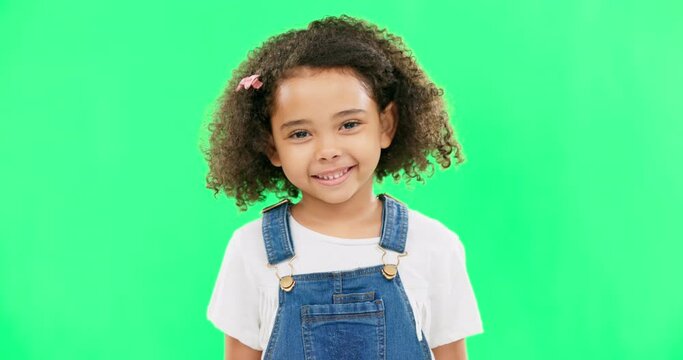 Happy little girl, face and green screen with smile of cute innocent child isolated against a studio background. Portrait of adorable kid smiling with teeth for childhood youth on chromakey mockup
