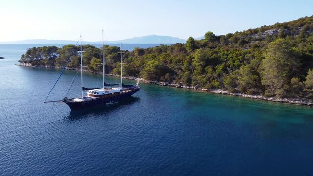 Aerial view above a yacht tied to shore in Miljet island Croatia