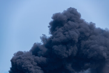 Black smoke from fire burning go to sky make more hi pollution destroying the environment and the...