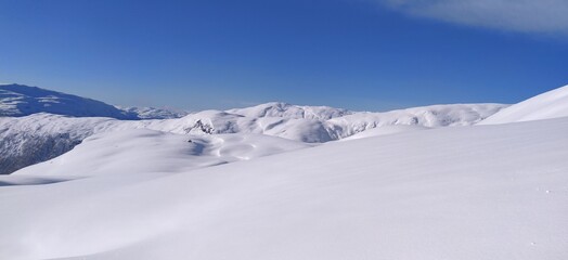 Fototapeta na wymiar Snow winter landscape with blue sky norway 