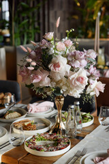 served table in the restaurant is decorated with a luxurious bouquet. Garden roses, eustoma, populus eucalyptus. pastel colours