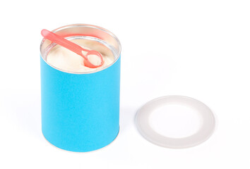 Baby milk powder in can that is open, with a spoon