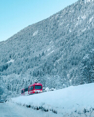 Red Train in Snowy Mountains in Chamonix, France