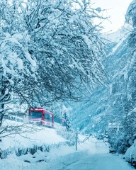 Red Train in Snowy Mountains in Chamonix, France
