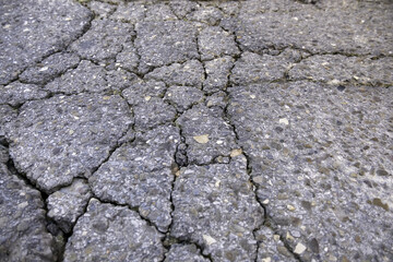 Wet and cracked asphalt