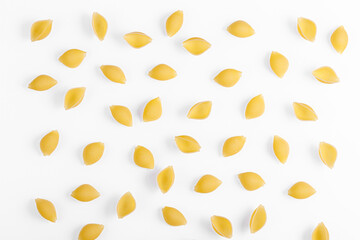 Pasta products in the form of a shell, texture, on a white background