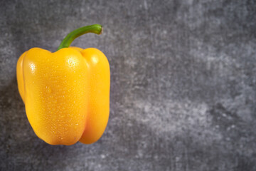 Yellow paprika on a gray background	