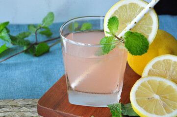 Glass of Fresh Grapefruit Juice with Mint and Lemon