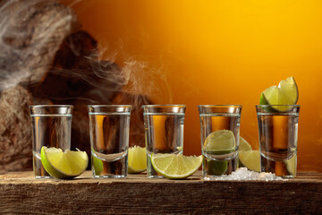 Tequila with salt and lime slices.