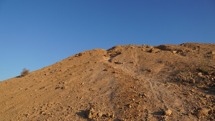 Sunrise view of HaMakhtesh HaGadol the big crater, in the Negev Desert, Southern Israel. It is a geological landform of a large erosion cirque