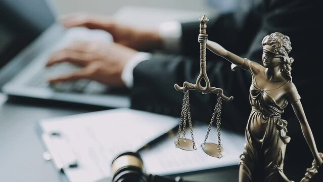 Male lawyer working with contract papers and wooden gavel on tabel in courtroom. justice and law ,attorney, court judge, concept.