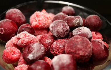 Closeup View Of Frozen Mixed Fruit Berries In A Glass Stock Photo
