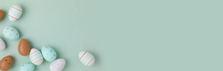 Easter frame of pastel colored eggs on light green background. Panorama, banner, flay lay, top view with copy space. - 582056765
