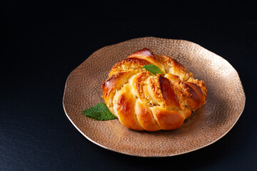 Food concept Homemade inside out hong kong coconut bun on black background with copy space