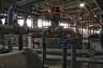 Steel pipes, tubes, steam turbine, valves, machinery, cables of modern factory. Gas boiler room industrial zone power plant. Pump engineering station. Technical equipment system. Energy water concept.