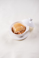 hot braised premium shark's fin soup and crab meat scallop in convoy superior stock white bowl on...
