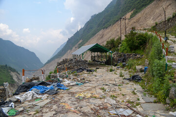 Fototapeta na wymiar Damaged building, pathway, sheds in Kedarnath disaster India. Kedarnath was devastated on June 2013 due to landslides and flash floods that killed more than 5000 people in Uttarakhand. 