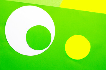 Abstract geometric shapes and lines green, yellow, white color paper texture background. Top view