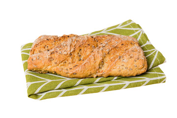 Freshly baked delicious french bread with napkin isolated on white background top view. Healthy white bread loaf