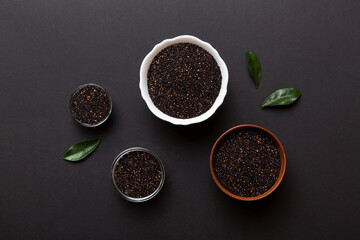 quinoa seeds in bowl on colored background. Healthy kinwa in small bowl. Healthy superfood